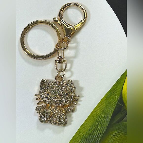 BAG CHARM Hello Kitty Gold Tone Crystal Hair Bow Bag Charm Keychain - Picture 1 of 6